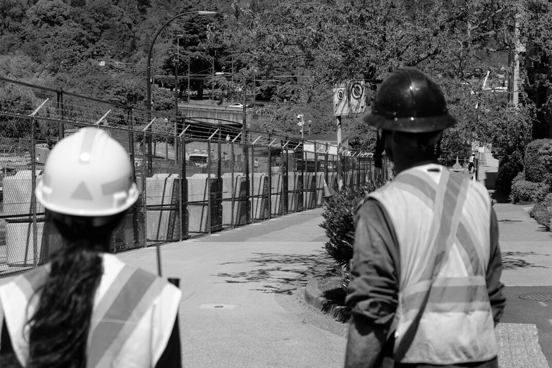 workers in safety gear at site