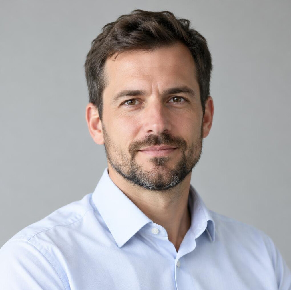 Portrait of a man with a beard in a casual shirt